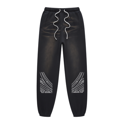 Track pants with moko print
