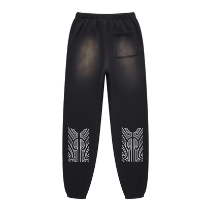 Track pants with moko print